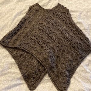 Brown knitted poncho.